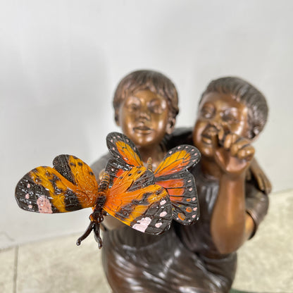 Boy & Girl Sitting on Stump with Monarch Butterflies Bronze Statue