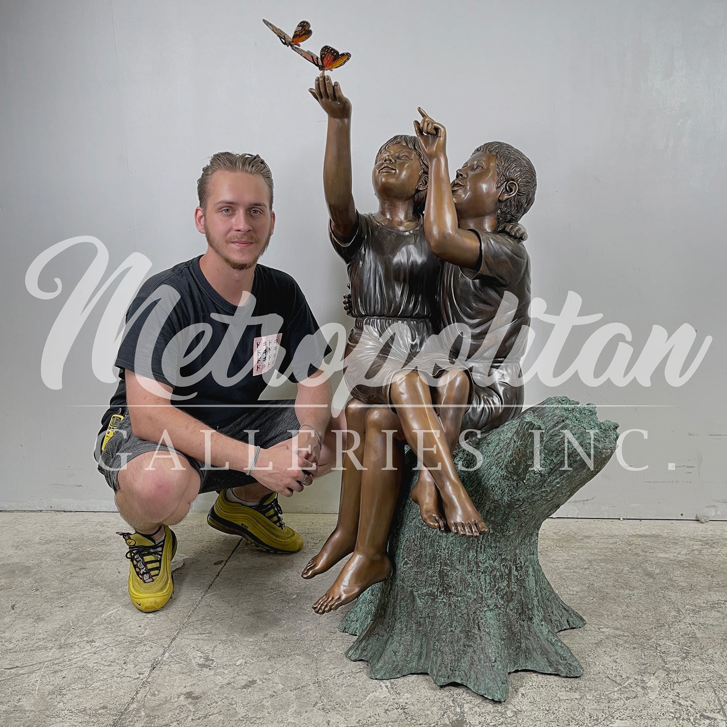 Boy & Girl Sitting on Stump with Monarch Butterflies Bronze Statue