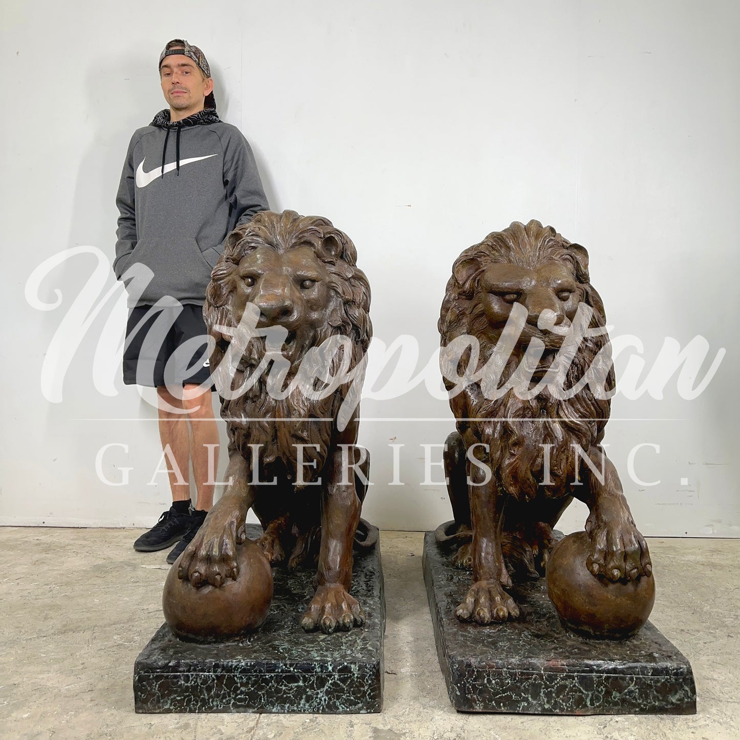 Sitting Lions with Ball Bronze Statue Pair